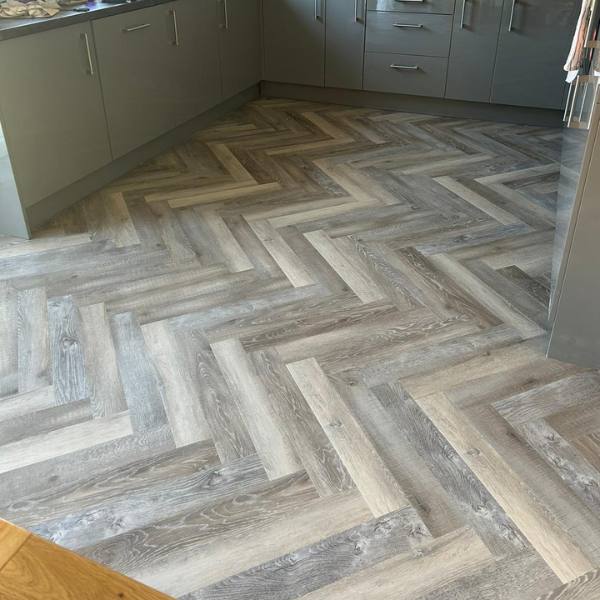 Herringbone luxury vinyl tile flooring installed in a kitchen in Northampton