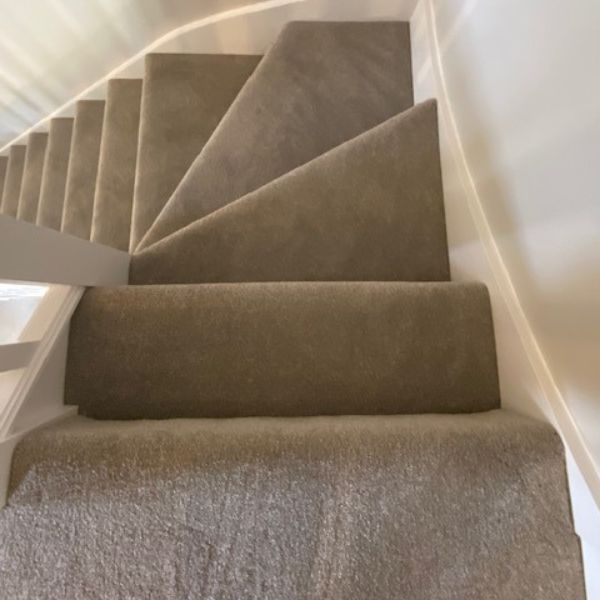 TriBeCa Carpet in Elephants Breath installed on winding stairs in Northamptonshire