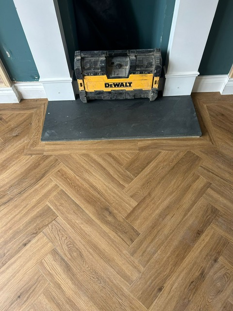 Studio Designs LVT - California Oak - Herringbone style, fireplace in Northampton