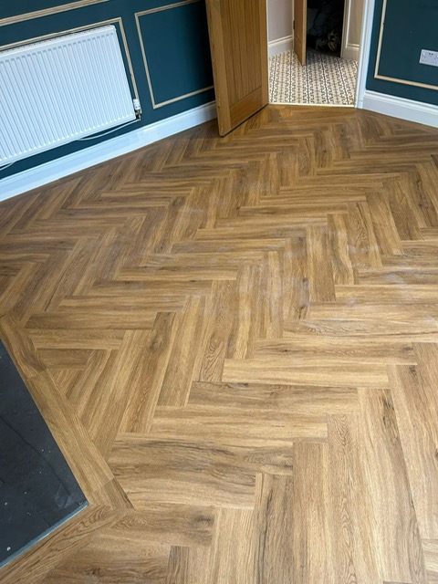 Studio Designs LVT - California Oak - Herringbone style laid in lounge in Northampton