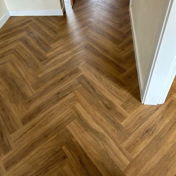 Studio Designs LVT in California Oak, Herringbone style installed in lounge in Northamptonshire