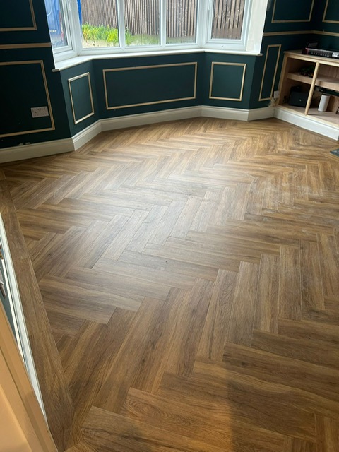 Studio Designs LVT - California Oak - Herringbone style laid in lounge in Northampton