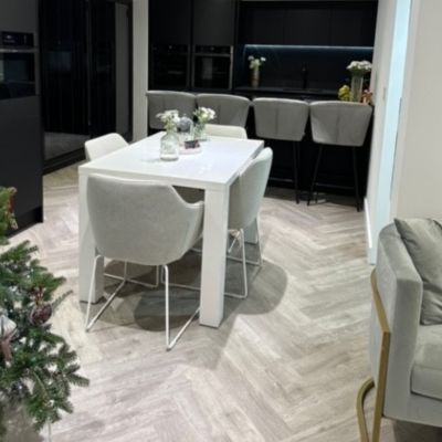 Beautiful kitchen diner fitted with versatile Studio Designs LVT flooring in colour county oak and laid herringbone style in Northampton.