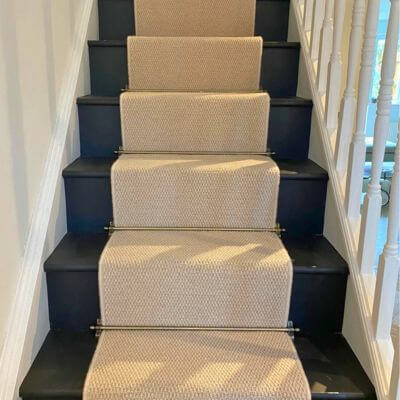 Hard-wearing Manilla Carpet installed on Stairs & finished with rods in Northamptonshire