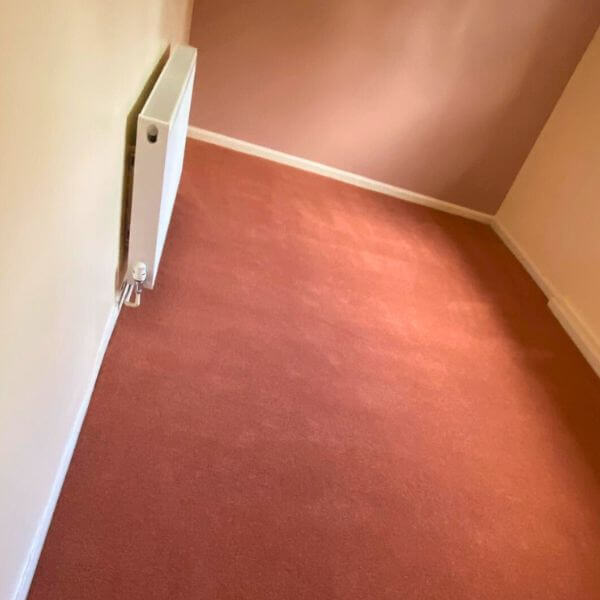 Stateside range carpet in a burnt orange installed in a bedroom in Kingsthorpe road in Northampton