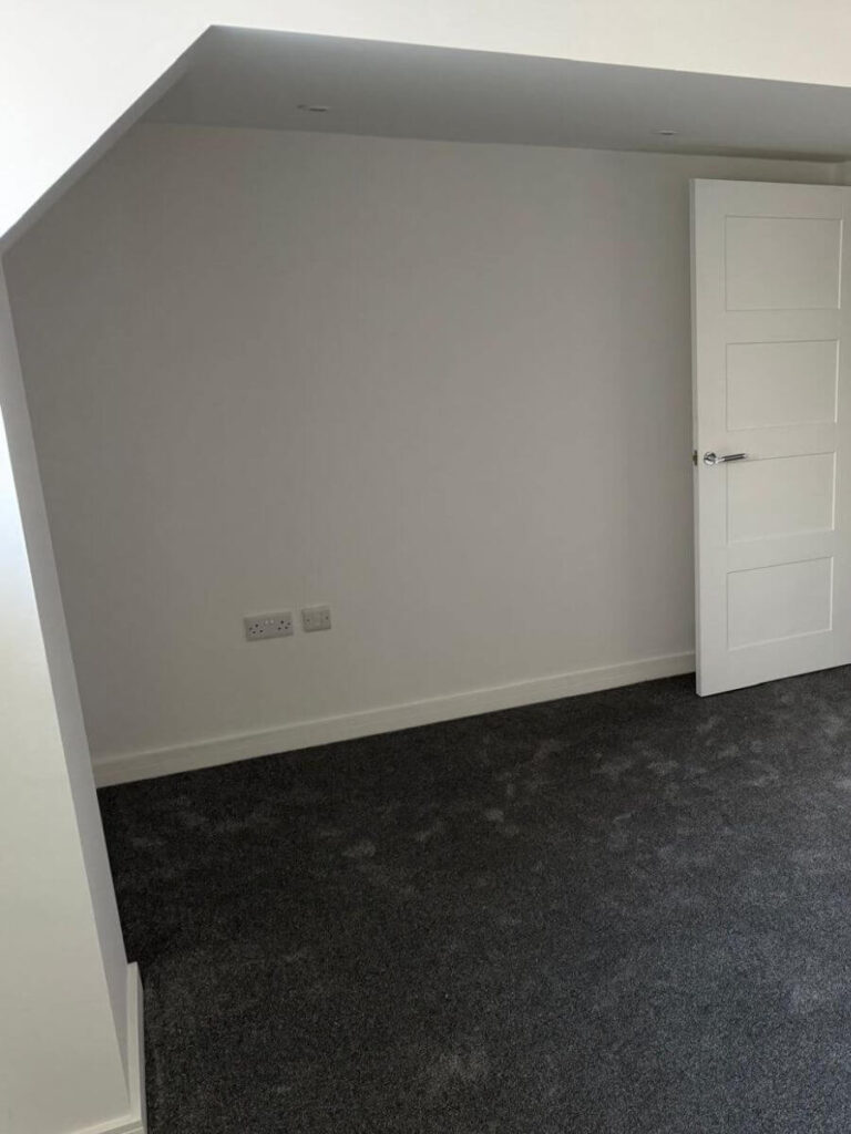 Grey Carpets installed in a bedroom at the flats at Allinson House in Northampton.