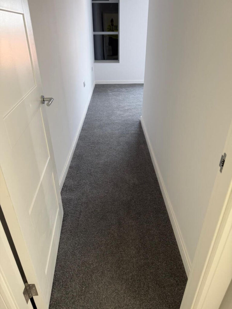 Grey Carpets installed in a hallway at the flats at Allinson House in Northampton.