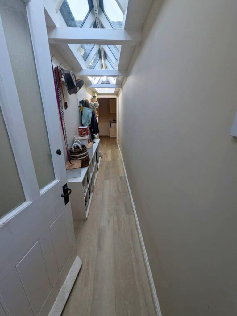 Light toned LVT Flooring laid in a hallway in Sywell, Northampton